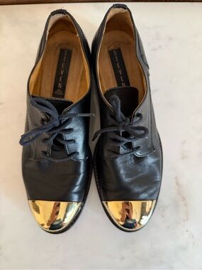 Steve Madden Black Leather Lace-Up Flats with Gold Cap Toe